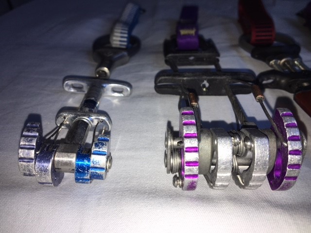 Black diamond C3 cams, x4 offset cam, purple cam, and friction belay device