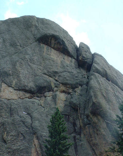 Climber on the left is at the first belay station. The second pitch goes to the large left facing dihedral. The 3rd pitch picks one of the 2 visible chimneys.