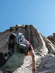 Mahlon Hewitt starting the Leaning Column (P1) on the Durrance Route, Devils Tower. Photo by Mike Dirksen.