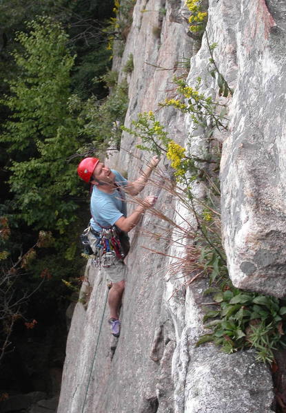 Climbing the runout face near the top of the first pitch. Photo taken from Frog's Head.