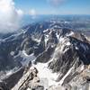 Looking south from the Grand Teton summit. From right to left: Middle Teton, South Teton, Icecream Cone, Spalding Peak, Gilkey Tower, Cloudveil Dome, Nez Perce. The two big peaks in the background are Mt. Wister and Buck Mountain.