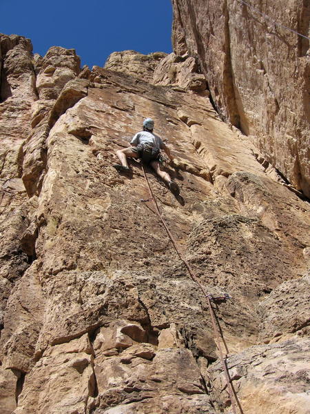 Peter Dillon preparing to traverse left at the third bolt.