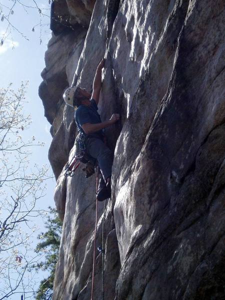 Reaching the horizontal after the second crux. You can do this move by heel hooking the ledge then laybacking on the black crack to stand up. The gear is below your feet as you stand up.
