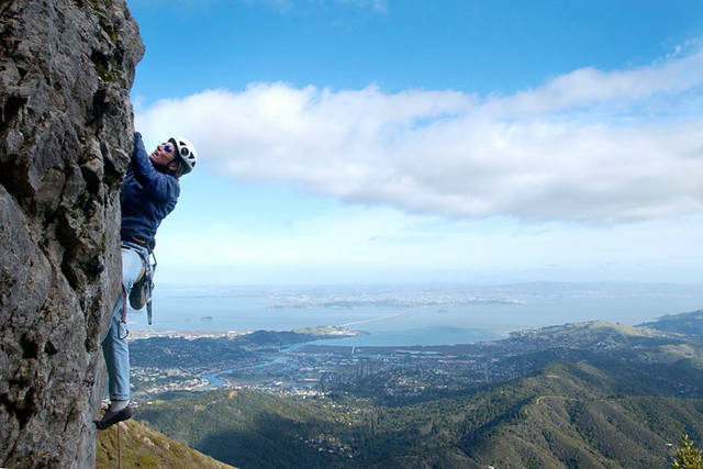Marisa Fienup, of Ventura, California, climbs the south face of Leaning Tower. Staying right on thin edges yields a line closer to 5.8 **.<br>
www.EarthworksImagery.com