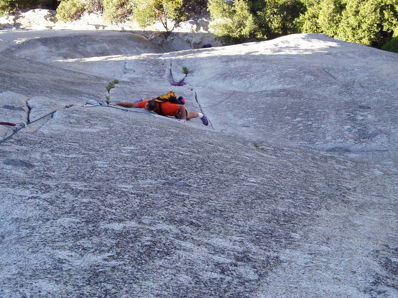 Paul is making the crux move switching cracks on the 10a P2 of Serenity Crack.