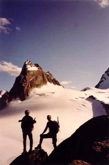 Tony and Fred pause on the descent of the Kain Route, Bugaboo Spire. Pigeon Spire in back.