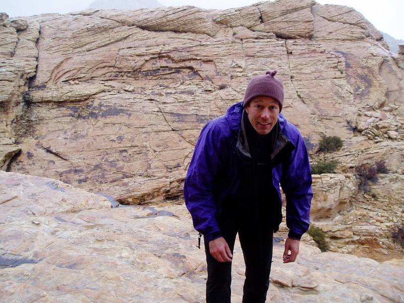 Retreating from the top of a climb in Red Rocks, NV in the Rain at the Sandstone Quarry area. Image by Chris Parks, 3/2006.
