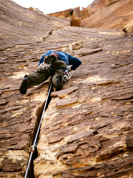 Andrew moving up the enjoyable third pitch. A few climbers on the 4th pitch corner can be seen above.