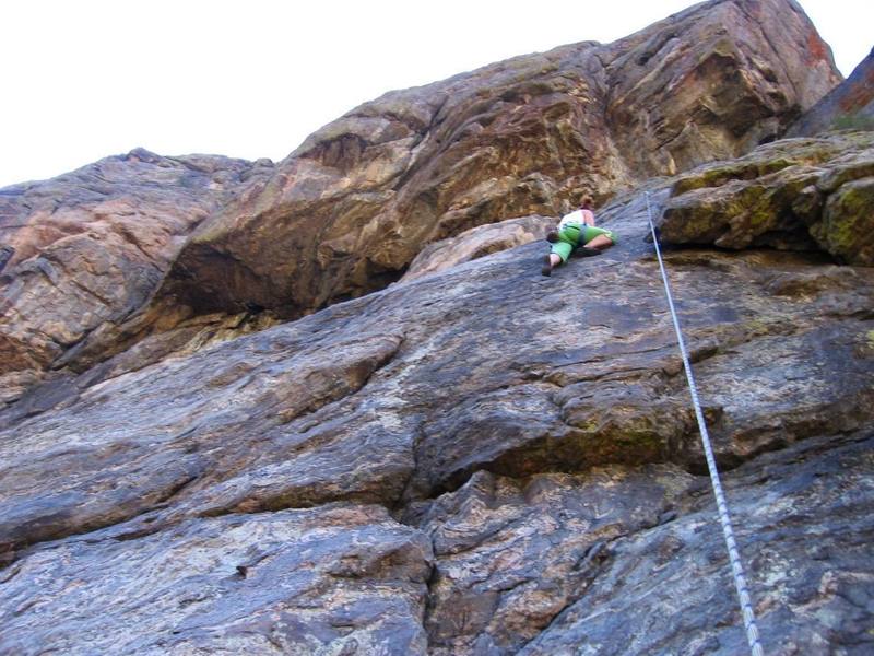 Minda working through the upper part of the crux. The People's Choice dihedral (P3) can be seen directly above.