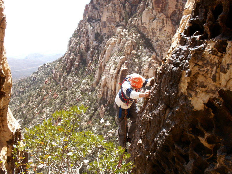 Larry climbs the picturesque 5th pitch arete during the FA while sporting the latest in swami attire.
