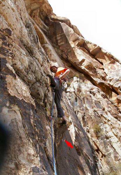 Larry firing in pro at crux of 2nd pitch. Notice a bolt of unknown origin indicated on the face to the right of the route.