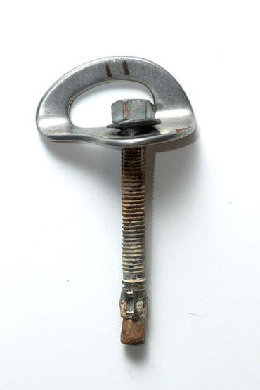 The wedge bolt shown in the photo is a 3/8" by 3-1/2" wedge bolt pulled from the summit boulder at the Foot. The bolt was pulled straight out of its hole using only moderate pressure. While this is not a climbing-specific bolt (such as a Fixe Wedge Bolt), the lack of pull-out strength is utterly shocking.<br>
<br>
The weak link here is the rock. Climbers should exercise caution when clipping bolts at this crag.