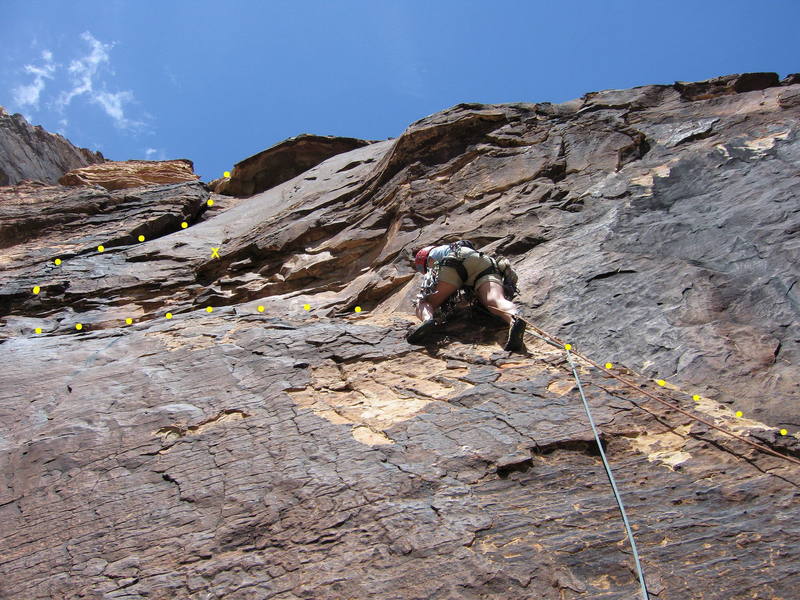 Sharon Vinick on the fun ramp at the start of P3. The crux traverse left past a bolt lies above, followed by a steep, airy corner.