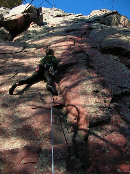Jerry Wingenter leads Coronary but takes the better variation to the start. Climbing the first moves of Charybdis (and clipping the fixed pin) then moving left towards the ramps and ledges below the meat of Coronary. Better start I think because it protects well and involves a nice mantle.