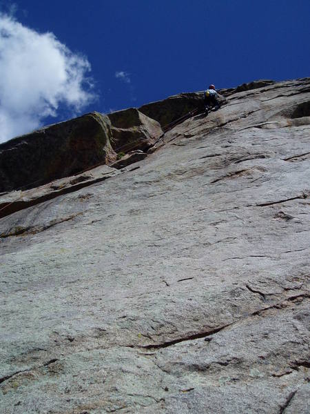 All done. Jugs and a good stance. Use long slings on the piece under the roof, and rope drag is minimal as you climb the easy upper slabs.