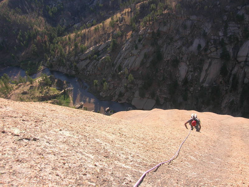 Mike enjoying the easy, but runout summit slabs.