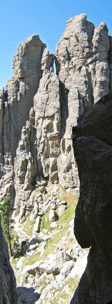 Spire Two (right) and Balcony Point (left) as seen from the International Chimney. The East Face Route starts behind the tree in the lower left of the photo.
