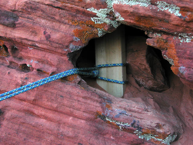 Photo of the namesake 2x4 used as one of our three natural anchors for rapping in to bolt the line.