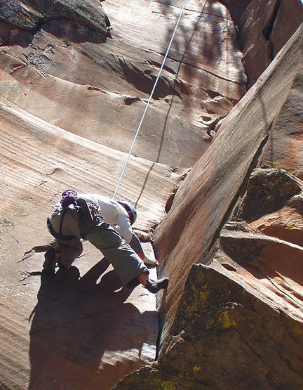 Climber working the layback portion of this route.