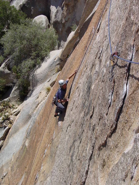 Continuous thin moves on steep rock all the way to a good rest at the beginning of the long traverse left to right.