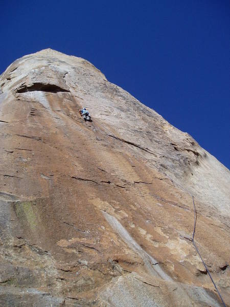 Paul finally gets a good rest at the 5th bolt. The route and first 4 bolts can be clearly seen in the photo. A good rest can be taken here before the long traverse to the right to the P1 anchors.