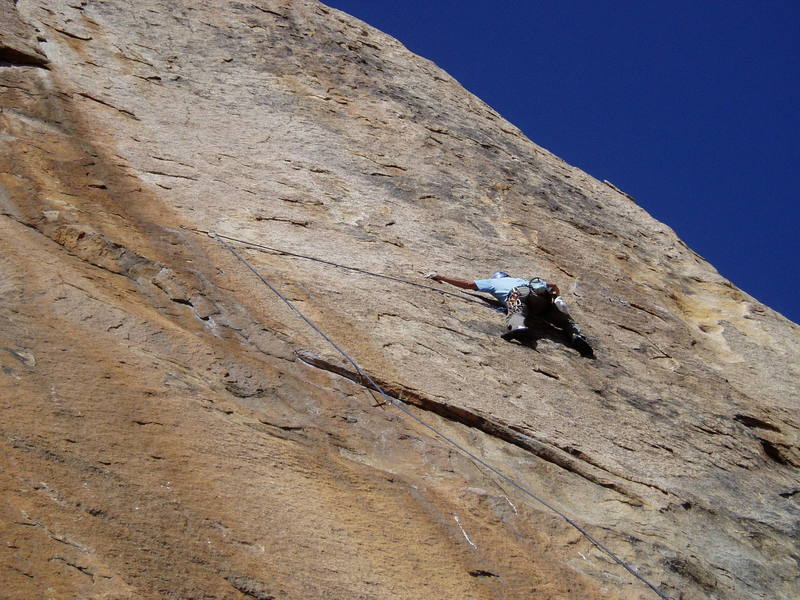 Although this traverse is quite run out, the climbing is quite easy all the way to the anchors seen to Paul's right. These are not the belay anchors for this climb. The hard and committing crux traverse continues from those anchors to the right another 15' or so.