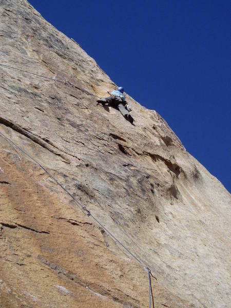 Paul feeling out the moves of the traverse. The belay stance can be seen on the skyline right of Paul's head. It's still a long ways to go. Although Paul's position is probably the right way to start the traverse, Paul got suckered into the low traverse which got pretty intense towards the end!