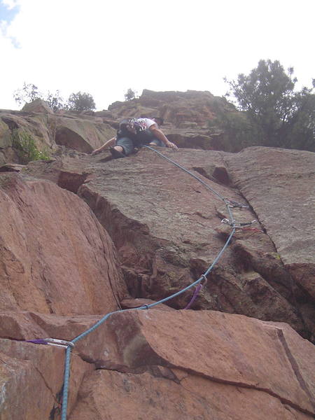 Solid gear below the crux. Good demonstration of runout to next ledge. From here, go straight up essentially unprotected 5.7 or make a couple of easy moves left or right to protectable easy climbing.