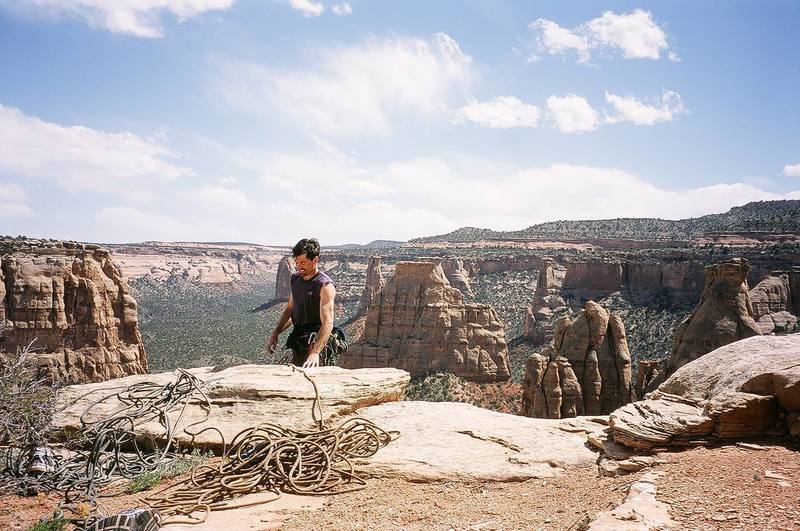 A 2006 photo of me at the top of "Lizards and Scorpions with Blue Sky and Clouds on Tuesday" or some other crazy route name. Nice view from the rim though. Image by Joseffa Meir.