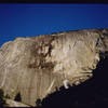 The NW Face of Half Dome is about 2,000' tall, and sheds skin like an onion with dandruff. Caveat escalator!