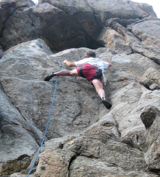 Peter Dillon climbing the headwall on Hair of the Dog. Continuing straight up past the bolt is 10a; traversing left is easier.