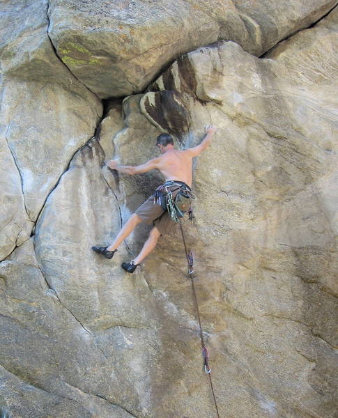 Jim Garber setting up for the crux 11d traverse on Linking Logs.