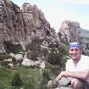 Todd on top of Owl Rock, with the Breadloaves in the background.