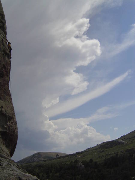 Matt on the runout section of "Scream Cheese" (5.9) with afternoon Thunderheads streaming by