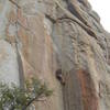 Chris G, placing more tiny pro after the lower crux, onsight lead 6/06