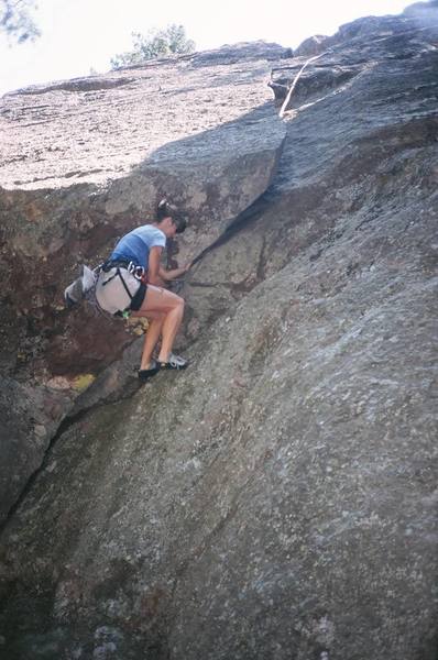 Patty Johnson passes the 3rd and final roof of Crankin'stein (5.9) on the Devil's Advocate in the Flatirons of Boulder, CO.
