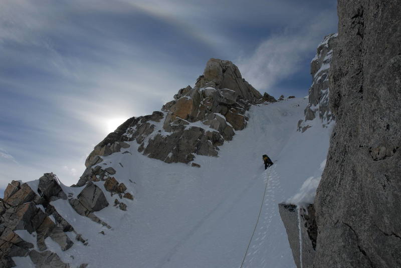 Seth makes the long and insecure snow traverse to gain the harder water ice in the center of the couloir. The ice went at WI3 and was sustained at about 70 degrees.