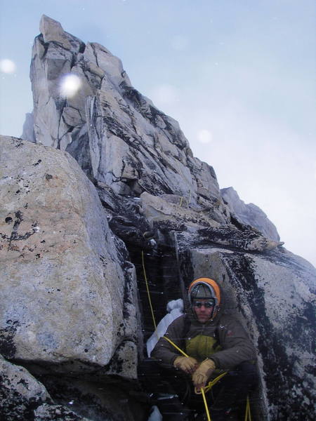 Seth Hobby belaying me (just visible further up) on Claw Peak in full-on conditions. Photo courtesy of Tom Gray.