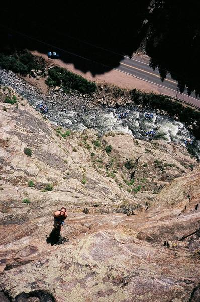The exposed view looking down from mid-way up P5 of Solid Gold (5.12a) on Creek Side Crag in Clear Creek Canyon, Colorado.<br>
Pictured: Josh Janes and many unknown rafters. Circa 7/'06.