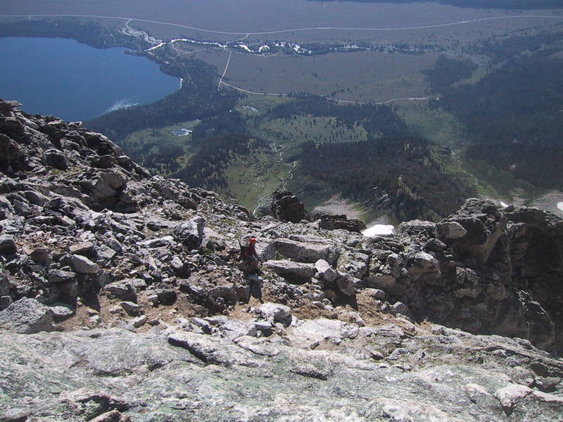 View from near the top back down the route. With good eyes, you can see your car. The climber in the photo is some guy who was doing the climb solo in a four day round trip (including driving) from Missouri; talk about making it happen.<br>