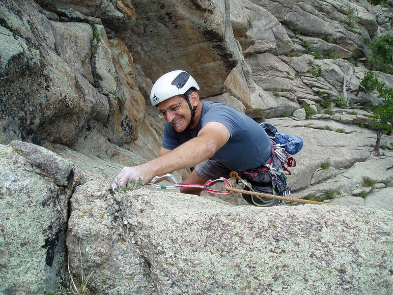 Chuck at the top of P1 in good spirits, unlike below at the roof crux (based on what we could hear from the belay ledge, the roof didn't go too well!).<br>
Photo by Luke Clarke.