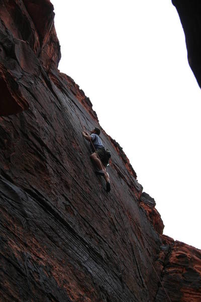 Dalon nearing the final crux move; very thin feet and lovin' that sloper edge!