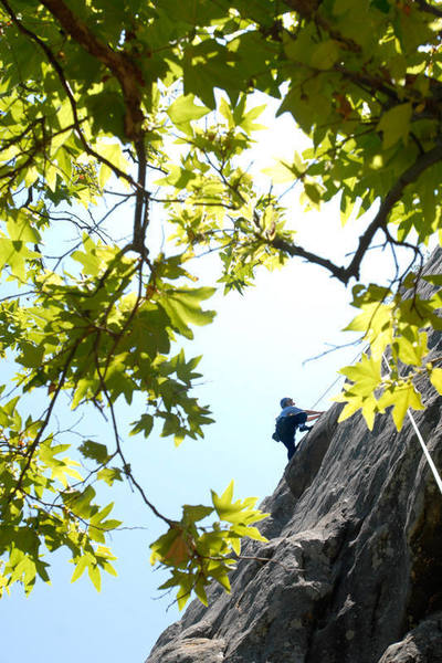 Patty Fienup passes the second crux (a big overhang with HUGE handholds) and is home free to the anchor.