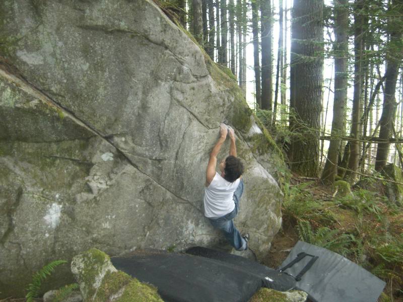 Sit down start on opposite side pulls to far right. Traverse up and to the left on slopers