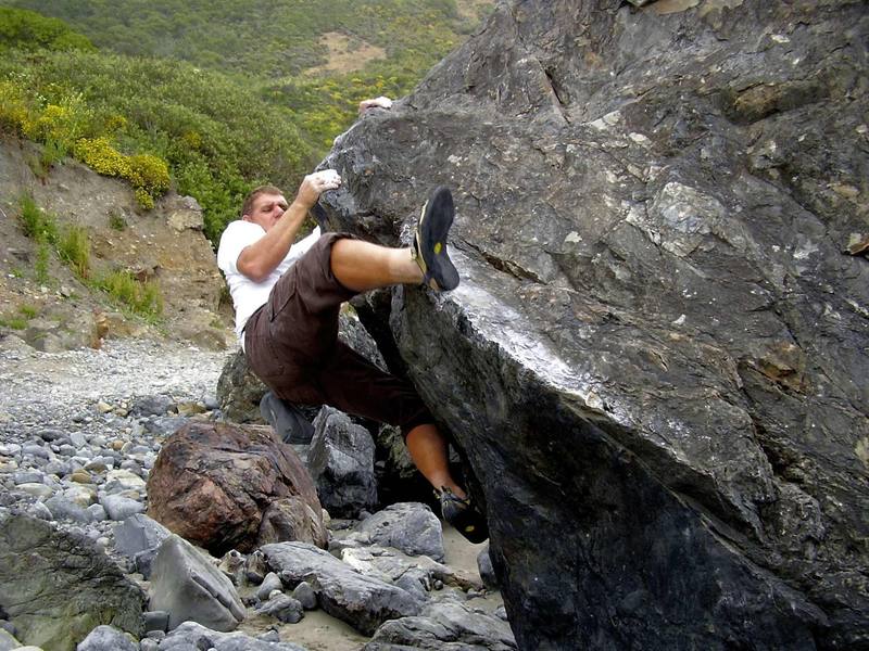 Unknown boulder, but has some nice routes ranging from v1 thru v5. A crash pad is needed in areas and a spotter is desirable as a spill even from 6' feet high will result in a nasty injury on the south side of the boulder.