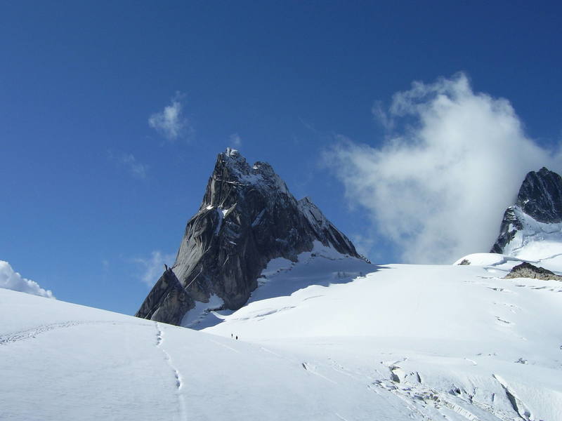 View of Pigeon Spire from the northeast. The West Ridge route follows the right skyline of the spire.