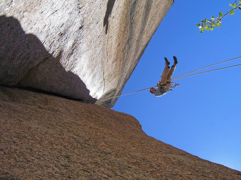If you don't notice how over hanging this thing is when climbing it, your sure will when rapping off....