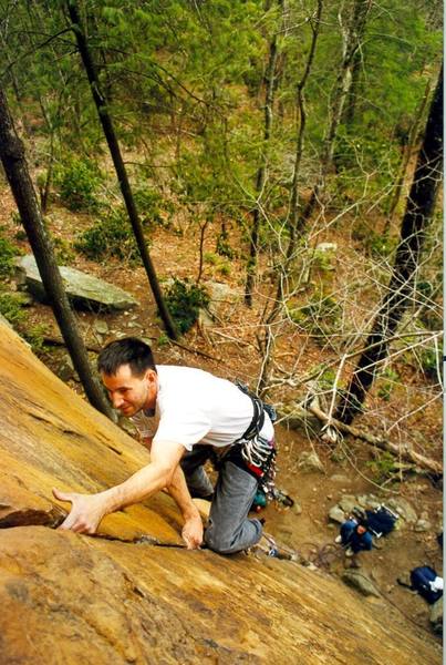 Brad Schneider leading the Shining, Tim Harrington belaying with his hands in his pockets