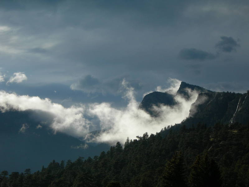 Sundance Buttress and Sundance Needle bathed in a shroud of rare low clouds, Lumpy Ridge, Colorado.