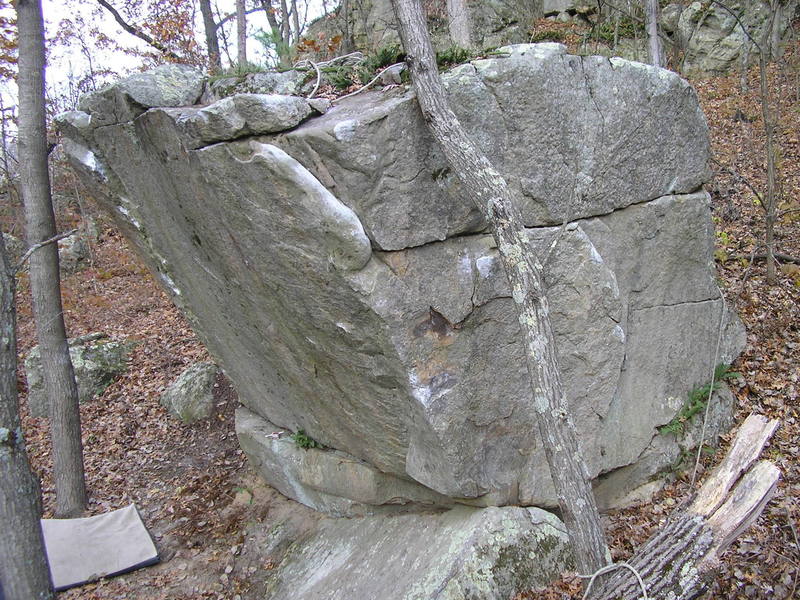 Start at the two holds just left of the tree- work left to the arete